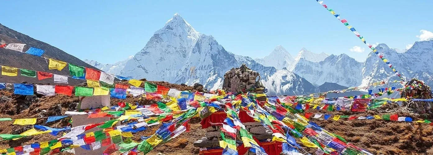 Colorful prayer flags against mountains